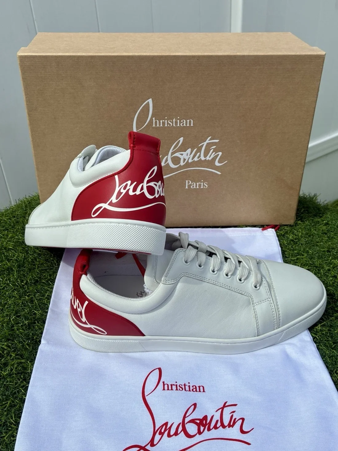 Christian Louboutin sneaker with signature red sole detail