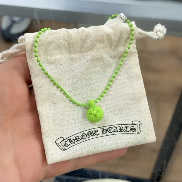 Green Chrome Hearts silicone bead necklace with its Chrome Hearts dust bag