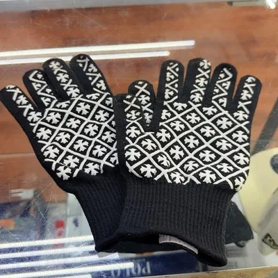 Black and white Chrome Hearts knit gloves with the cross pattern