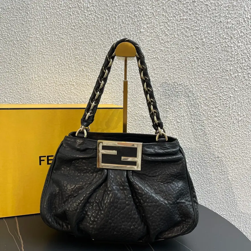 Black Fendi leather shoulder bag with its yellow Fendi box