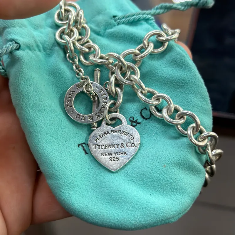 Tiffany & Co. silver heart-tag necklace — store jewelry catalog with gold, diamond, silver and designer pieces