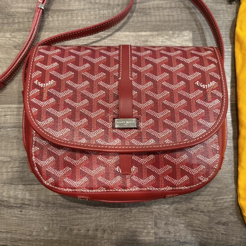 Red Goyard messenger bag with leather trim