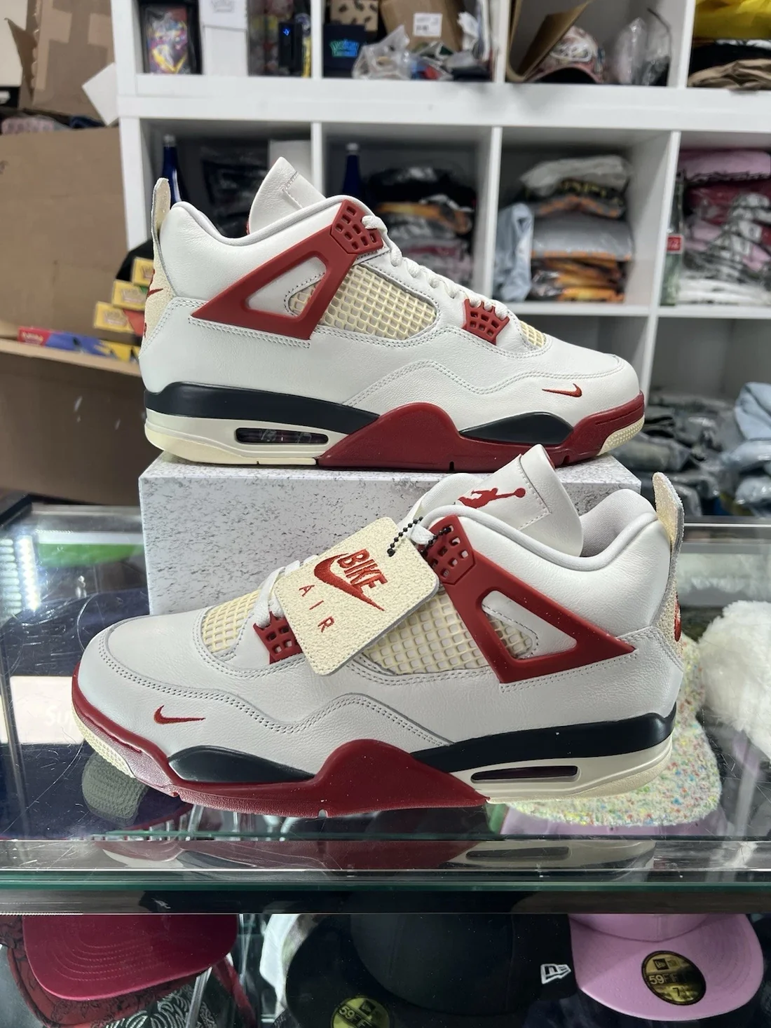 Air Jordan 4 Cherry sail and red sneakers