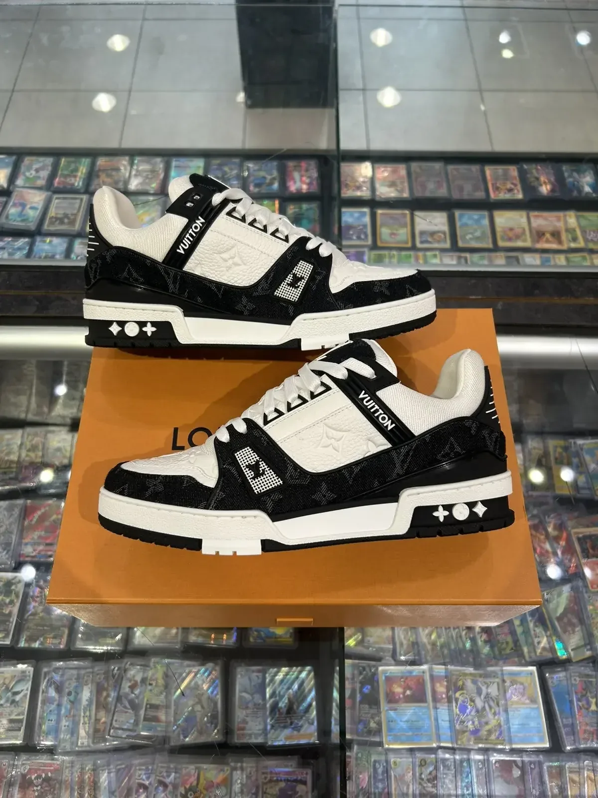 Louis Vuitton Trainer sneakers displayed on box in NYC store