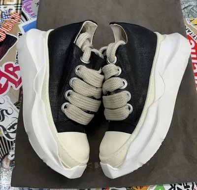 Black and white Rick Owens sneakers with jumbo laces