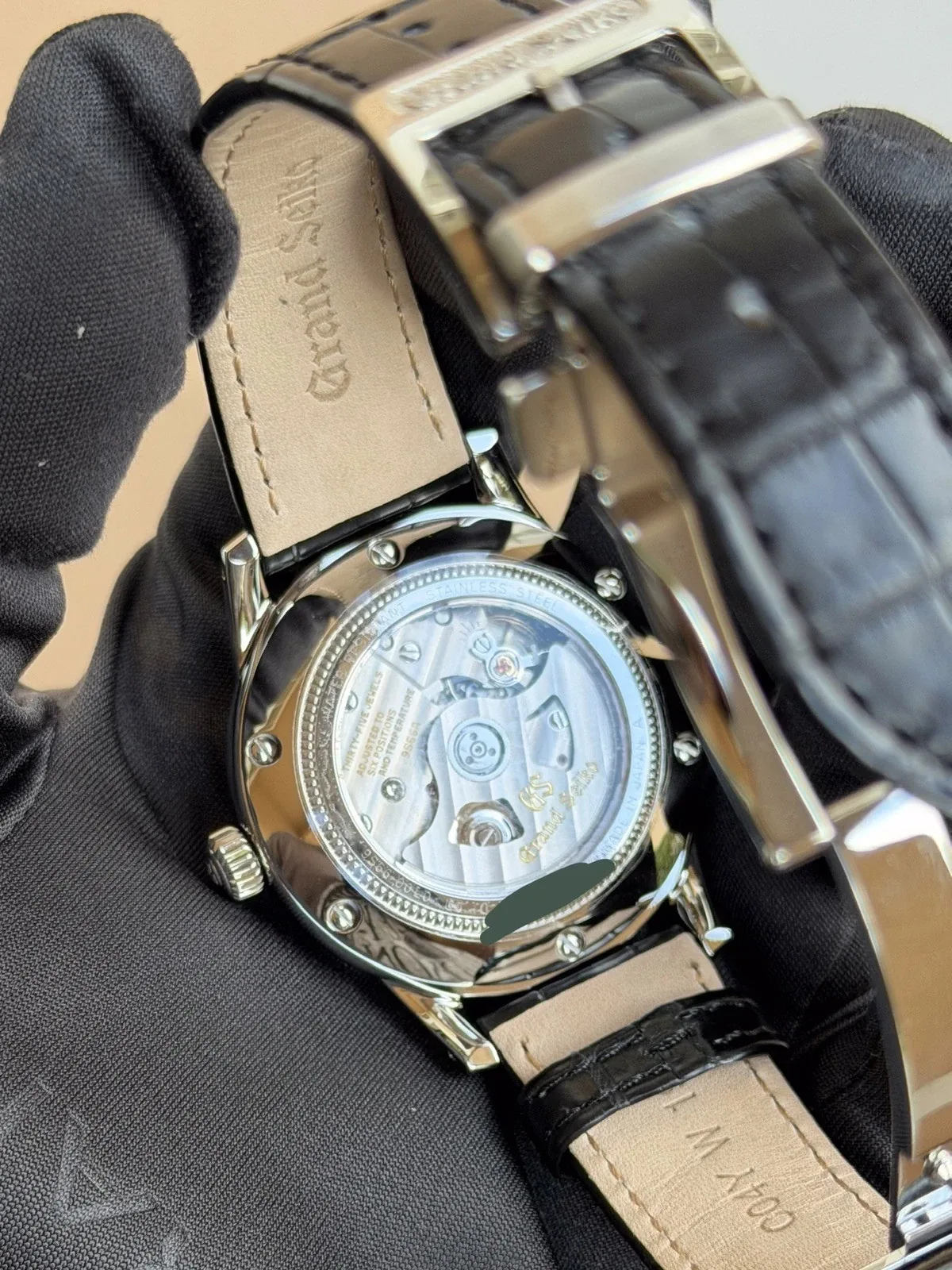Checking a watch movement through a clear caseback